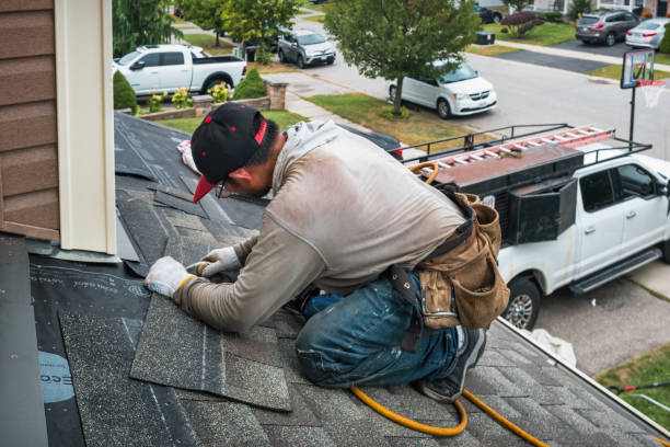 Professional Roofing technician working in Yantic, CT